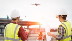 Image of surveyors using aerial observations, GPS, and robotic survey systems to conduct a legal property survey. Comparing current land condition with historical boundaries and improvements. Ensure accuracy with our professional surveying services. Contact us for a comprehensive land survey.